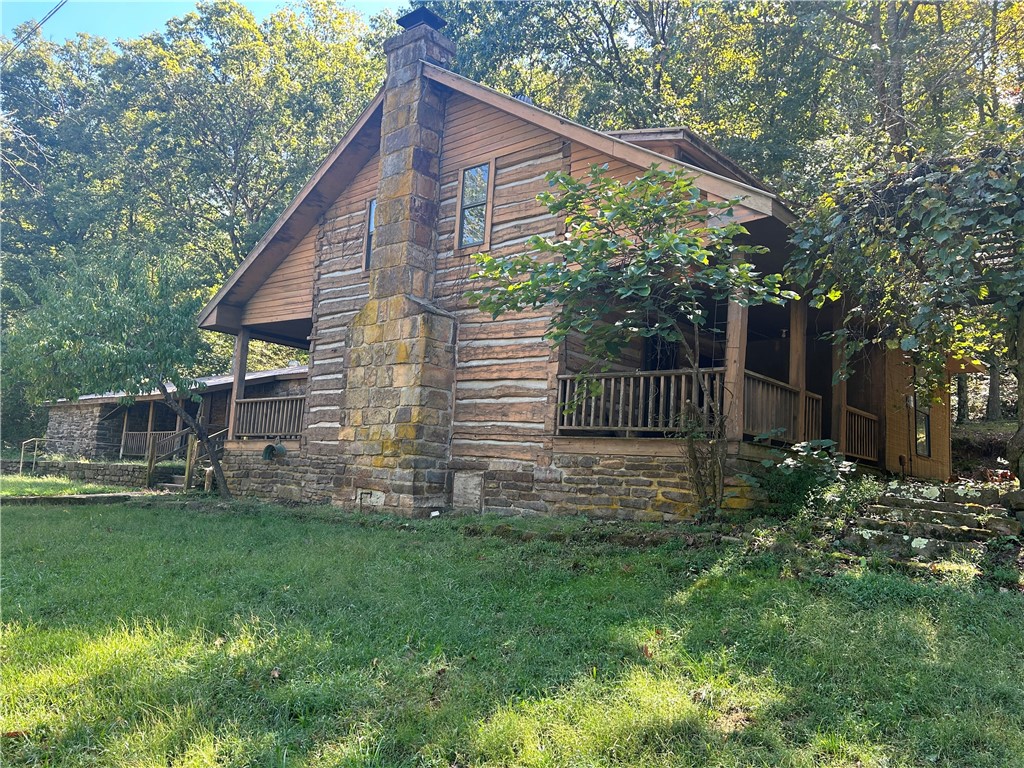 This Home is waiting for a New Owner to make it A "Jewel of the Ozarks" that it once was. You are sure to Love the Log Home Features of this inviting Home nestled on a Beautiful 1.5 acre Lot. There are also many treasures to uncover such as the Native Stone Rock wall in the Back, as well as, the Rock Lined Drainage area catching water after a good rain. With a little work this definitely has the potential to be a Breathtaking, Show Stopping Property.
Property SOLD "AS IS"
