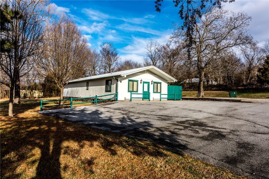 Hwy 71 Frontage! Perfect for your business! Former veterinary clinic on 2.08 acres featuring cedar exterior, metal roof, 1,632 SQFT, 10 rooms, ceramic tile & concrete throughout, 6 chainlink kennels, Waiting Room, Four Exam Rooms, Full Bath, Utility room & Extra Storage. Built-ins & cabinetry throughout. Back kennel area has heat & air! Blacktop parking lot and tree studded lot. Hurry & see your new building & acreage!