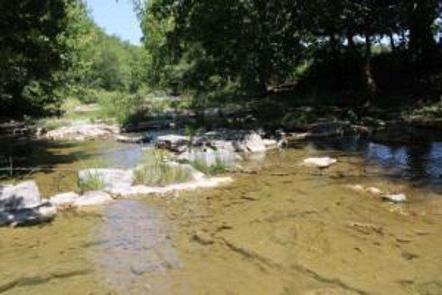 Year Round Creek, Brick Home, 3 Barns on  92.53 Acres only 8 Miles Out - Approx 1/2 mile of Huzzah Creek, 2 year round springs/spring branches nice brick home with full basement , total 4 bedrooms, 3.5 baths, living room and family room, two fireplaces, kitchen has brick cooking area, stainless appliances, utility room with 1/2 bath, deck off master bedroom, 30x40 and 40x100 metal buildings, pipe corrals, wood barn, older 5 stall wood pole equipment shed, hay fields, pasture and wooded land, Plus end of lane location!! This is everything you could want rolled into one place, aerial map in Documents - make your appointment & see it today!!