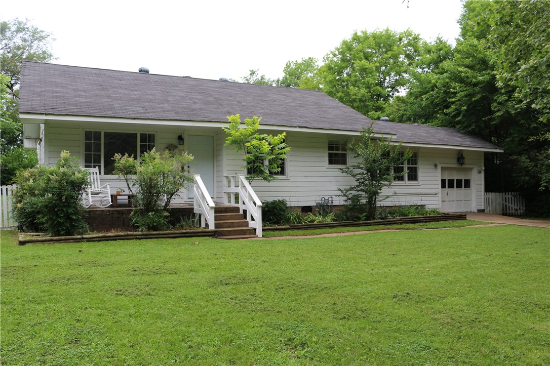 This newly renovated farmhouse features 2 bedrooms and 2 bathrooms with a bonus room that could be used as a home office or den. It has a large backyard, spacious screened in porch, and an attached 1 car garage. The large windows all around the house bring in an abundance of natural light! The spacious kitchen opens to the dining area and boasts of new stainless steel appliances, classic subway tile backsplash, high cabinets and a pantry. This home features vinyl plank floors throughout and washer/dryer is included. The large backyard has ample outdoor space that backs up to an empty field and has the most beautiful sunset views. The ductless mini split heating and air system offers room-by-room temperature control while saving you money on your energy bill. You get the best of both worlds with a quiet street, yet just one mile from the UofA, and easy access to the freeways. Just a 10 minute walk to the Meadow Valley Trail.