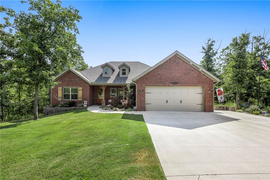 Discover this charming all-brick home, built in ’23, featuring designer paint tones, rich stained beam accents, cathedral ceilings, and a flexible 2 bedroom + bonus room layout. The spacious primary suite offers a jacuzzi tub & walk in closet, while LVP flooring adds style and durability throughout. Upgraded SS appliances. Relax on the covered back porch with peaceful wooded views perfect for relaxing & entertaining. Located on a corner lot in a quiet cul-de-sac, just minutes from I-49, this home offers easy access to Bella Vista lakes, golf courses, and mountain biking trails, plus nearby Branchwood Rec Center. A perfect blend of comfort, nature, & convenience! Extra concrete parking pad for added convenience.  2 Bedroom Septic.