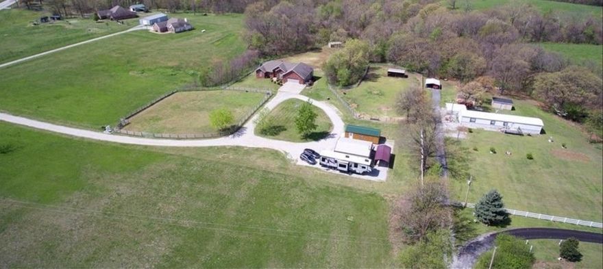 Imagine owning a serene 5-acre property within the Gravette city limits, where every day feels like a vacation. This beautiful land is fully fenced, ensuring privacy and security. The property is adorned with stunning trees that provide a picturesque and tranquil environment. Essential utilities such as city water, electricity and sewer are already on site, making it convenient for you to build your dream home. The previous home, which was unfortunately burned, has been removed leaving a clean slate for new possibilities. For those with a love for animals, there are outside buildings perfectly suited for housing them. Whether you envision a small farm or a peaceful retreat, this property offers the ideal setting. Come home to a place where nature's beauty surrounds you, and the convenience of city amenities is just a stone's throw away. This is more than just land; it's a lifestyle waiting to be embraced.
