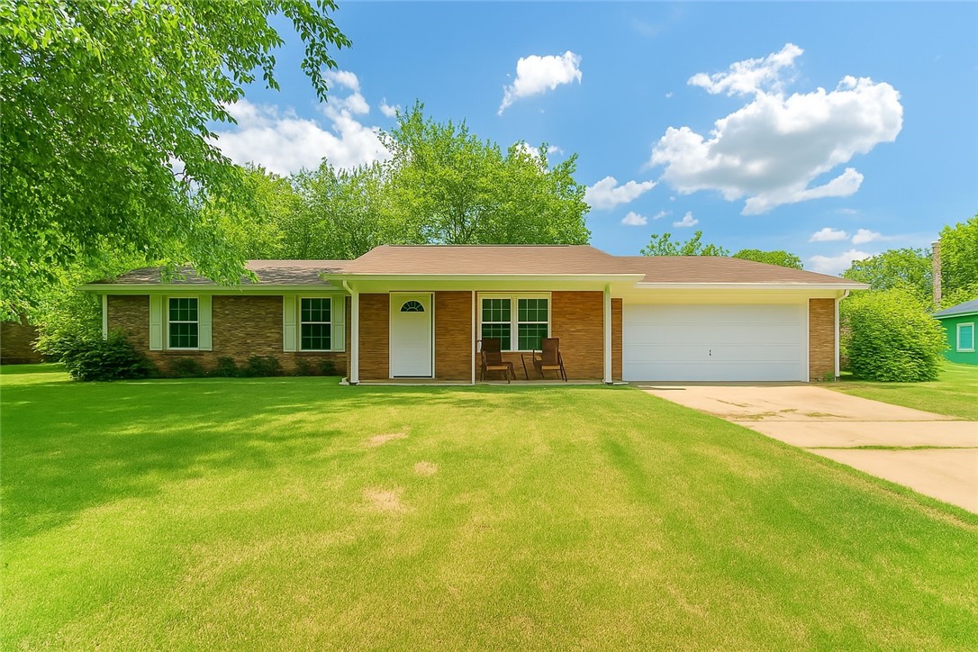 Welcome to 606 Hinshaw, a spacious and versatile home tucked away in a quiet corner of a well-established Springdale neighborhood. This charming property features 3 bedrooms and 2 bathrooms, including two converted bedrooms in the garage—ideal for guests, a home office, or extra living space and also an attic fan. The backyard is thoughtfully divided with a split fence, offering a cozy lounge area for entertaining and a separate space for pets and shed. Whether you're relaxing outdoors or enjoying the peaceful setting, this home offers the perfect blend of comfort and convenience. Close to schools, parks, and all the amenities Springdale has to offer!