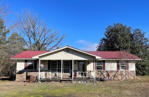 X marks the spot! Lying on over an acre and over 1500sqft home, 2 storage sheds, storm shelter, and carport for additional parking, this treasure has great potential for your next homestead. River Valley views from your back yard! Utility information/condition is unknown.