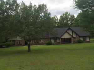 COMPLETELY REMODELED~ NEW roof, windows, lighting, Paint inside and outside, AC, ALL flooring, ALL cabinets,ALL counter tops, now imagine the space 4 BR, 2 1/2 BA, 2 Living areas, sunroom/porch, office, 3.31 acres, shop. With all the new and the space you will love the upgrades like granite counter tops in the kitchen and master bath and hardwood floors. This is a must see!
