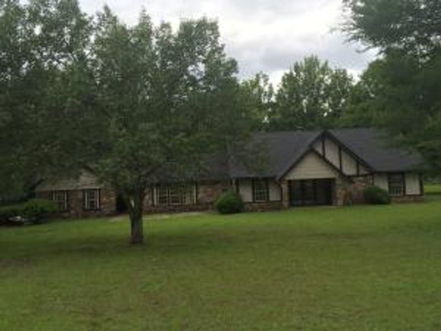 COMPLETELY REMODELED~ NEW roof, windows, lighting, Paint inside and outside, AC, ALL flooring, ALL cabinets,ALL counter tops, now imagine the space 4 BR, 2 1/2 BA, 2 Living areas, sunroom/porch, office, 3.31 acres, shop. With all the new and the space you will love the upgrades like granite counter tops in the kitchen and master bath and hardwood floors. This is a must see!