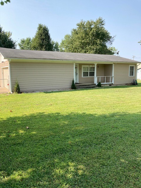 Big yard with chain link fencing, corner lot, covered deck, workshop, siding on home 2 years old, newer roof, hardwood floors, c h/a, 2 car garage with opener, new double pane windows
