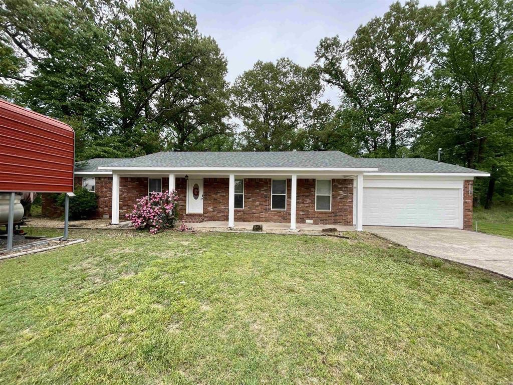 Well-maintained 3BR/1BA brick home in a quiet Morrilton neighborhood. Interior features a spacious living area, galley-style kitchen with stainless steel appliances. Refrigerator conveys. Situated on a level lot with a large, fenced backyard and storage shed that conveys. Covered carport and a clean, low-maintenance exterior make for easy living. This long-held family home has been well cared for and is move0in ready. Convenient location just minutes from downtown Morrilton with quick access to I-40. Ideal for first-time buyers, downsizers, or investors looking for solid value in a well-established area.