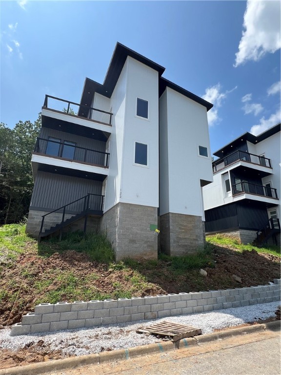 Brand new and perfectly located in South Fayetteville, this home offers easy access to trails, schools, and more. With rooftop terraces showcasing beautiful views, the home features a gas fireplace, built-in cabinets in the master suite, and a two-car garage with frosted glass doors. Inside, the open floor plan highlights hand-scraped hardwood floors, a sleek kitchen with granite countertops, stainless steel appliances, and a built-in pantry. The master suite is a true retreat with scenic views, a spa-like bathroom, and a spacious walk-in closet. Guest bedrooms offer plush carpeting, and the home is finished with custom landscaping and laundry hookups. This one wonāt last longācome see it today!