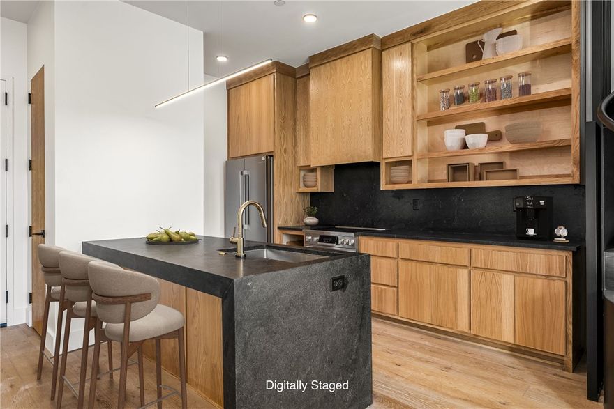 Enjoy the convenience and energy of downtown living at The Haven, a 29-unit luxury condominium community in the heart of Bentonville. With only a limited number of residences available for lease, Unit 210 — the de Kooning Loft — offers an exceptional opportunity. This stylish two-level residence features a spacious open-concept living area and a thoughtfully designed kitchen equipped with premium BOSCH appliances, including an upgraded induction range. Upstairs, two private bedroom suites each offer their own ensuite bath, creating comfortable and functional living spaces. The unit also includes a rare two-car garage. Residents of The Haven enjoy a secured building with elevator access, ideally located just one block from the Walmart Home Office and within walking distance to local coffee shops, dining, and everyday conveniences. Downtown Bentonville Square is less than a 10-minute walk away, and the Razorback Greenway is located less than a block from the property.