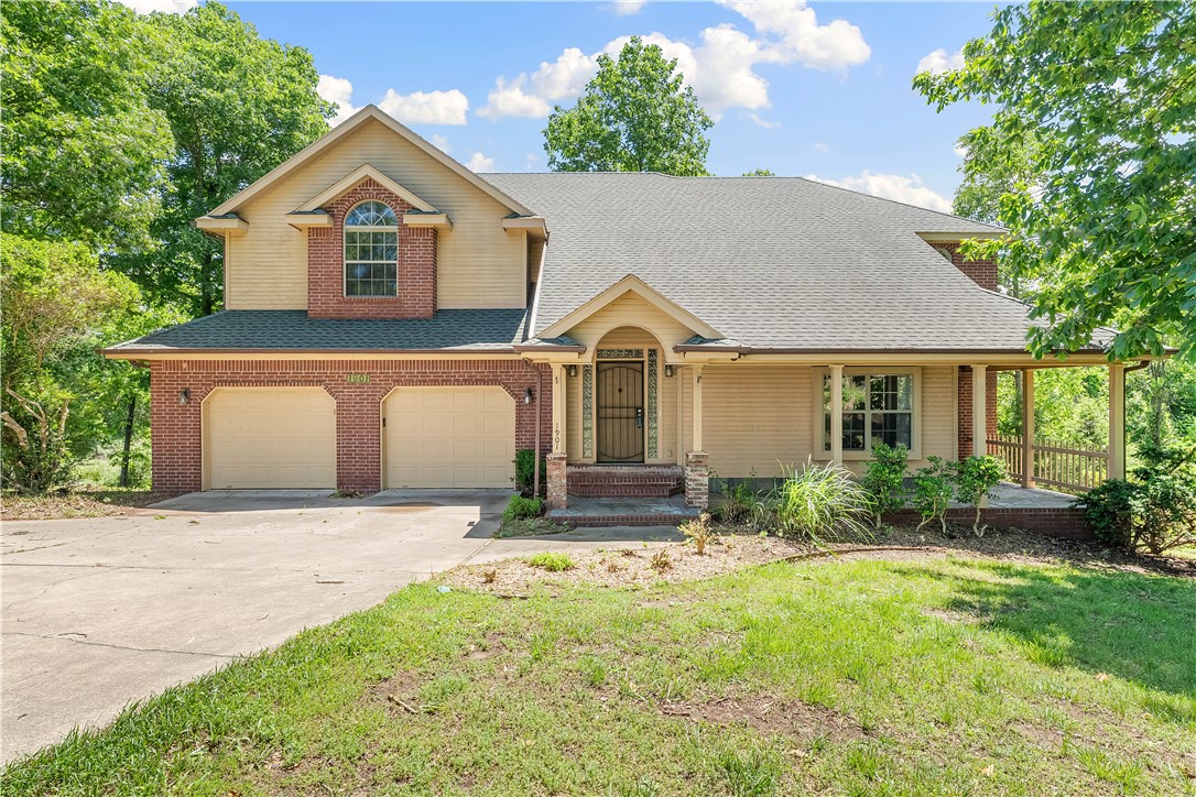 This home has the best of all worlds! Nestled on 2.73 private acres with easy access to everything you could possibly need (5 miles to I-49, 2 miles to Hwy 71, and 2.5 miles to Beaver Lake). Enjoy the serene, natural setting of the outdoors on any of the 3 covered patios or covered front porch. With pristine wood floors, a functional kitchen with a dining area, and large laundry room with sink, the home has both an inviting warmth and functionality. The primary suite is filled with natural light and has a huge walk in shower and jacuzzi tub and an enclosed patio. Come see the massive garage! With over 30 feet of length, save on boat dock fees and store your boat or park several cars. If climbing stairs is an issue for anyone in the family, a stair lift is installed to safely take you to the second floor. This charming home is conveniently located just minutes from the Monte Ne boat ramp, Horseshoe Bend Marina, Downtown Rogers, the Railyard, shops and the Entertainment District.