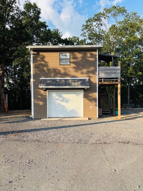 Rare 9-acre multi-use property with Hwy 65 frontage! Includes 2 homes & 2 RV hookups w/dedicated electric. Main home: 1 bed/1 bath, 2-story w/escape hatch, spray foam insulation, 6ā walls, fenced yard, & garage w/heat/air, electric, & small kitchen. Cabin: 1 bed/1 bath w/view of year-round creek & seasonal waterfallāgreat for Airbnb, mother-in-law, or teen space. Features 40āx9.5ā storage container, French drains, grape vines, fruit trees, chicken coop, 50-yr metal roofs (2024), well w/filtration system, laundry in well house, propane backup, city water access, circle drive. All appliances inside the homes stay. Surveyed; mineral rights may convey.