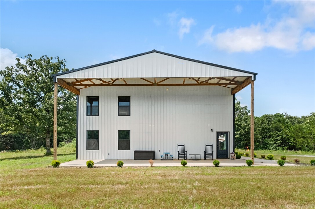 Escape to country living with this stunning 4 bed, 2.5 bath barndominium on 18.01 acres just 10 minutes from Gravette schools! With 1,860 sqft of living space and a 1,200 sqft attached shop, this home blends modern comfort with rustic charm. Enjoy the oversized front porch, perfect for morning coffee or evening sunsets. The spacious layout includes a large laundry room, a luxurious primary suite with a massive walk-in shower, and an instant tankless water heater for endless hot water. Ideal for hobbyists, homesteaders, or anyone craving room to roamāthis property offers space, privacy, and endless potential in beautiful NW Arkansas. The property is fenced and includes a small pond for cattle.