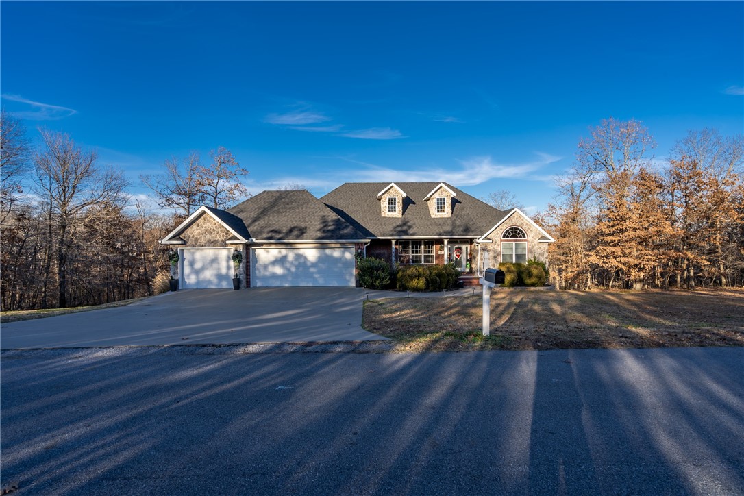 Gorgeous 3 Bed 3 Bath home plus office on three lots totaling almost an acre! Office could also be used as 4th bedroom. Lake Loch Lomond is just down the street. New roof,hot water heater & garbage disposal in 2022. Some new siding,exterior paint & freshly stained deck in 2023. This home has so much to offer! Basement could be an in-law suite with living area,mini kitchen,bedroom & full bath with a covered patio. Has 3-car garage,custom cabinets in kitchen with pull out shelves pantry,built-ins,extra storage,laundry with sink,crown molding,columns,tall ceilings,double sided gas log fireplace,gutters, walk-in closets, granite counters, canned lighting, formal dining & eat in kitchen, three living areas, deck & covered patio, whirlpool tub, shower & double sinks in primary bathroom, vanity sitting area in full bath, security system, generator bypass panel in garage & much more! Refrigerator in kitchen & basement will both convey along with TV above fireplace, Vizio soundbar & propane tank for the gas grill & gas log.