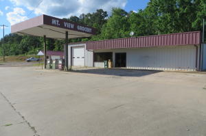 Business opportunity near the lake! Groceries, gas, food and more are just a few options for this location. An outbuilding also has served as a bait shop to the lake down the street. All equipment conveys.