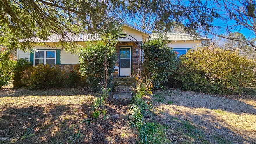 If you’ve been dreaming about quiet country living, this hilltop home might be just what you’re looking for. Sitting at the top of a hill, it offers peaceful views, fresh air, and plenty of privacy.
Inside, you’ll find 3 bedrooms and 1 bathroom, with brand-new flooring in the living room, bathroom, and all the bedrooms. Giving the home a clean, updated feel. 
Out back, there are woods that add privacy and a beautiful natural backdrop. A wet-weather creek runs on the property, adding even more charm to the setting. There’s also plenty of space for gardening, whether you’re thinking about flowers, vegetables, or even a small homestead setup.
It’s a great spot if you’re looking to slow down, spread out, and enjoy a little more peace and quiet.