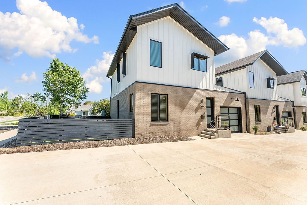 Discover cutting-edge living in this exceptional property, designed for modern functionality and style. Located in a prime Bentonville neighborhood with top schools, this standalone gem features two levels of luxurious design. Inside, you'll find sleek European appliances, custom cabinetry, a built-in refrigerator, and a wine fridge — perfect for the discerning homebuyer. The 1-car garage is EV-ready, with additional parking and a bike washing station nearby, making this home ideal for those on the go. Enjoy your private patio and side yard, or relax in the curated pocket community with its dog park, green space, and pavilion with fire pit — a haven for pet owners and dog walkers. With incredible amenities, offering a seamless blend of technology and elegance, just minutes from downtown, top bike trails, Walmart HQ, and XNA. It is truly an honor to present one of the best values in the Bentonville market! An additional designated parking space is assigned to the property. Bonus: Refrigerator, Washer & Dryer convey!