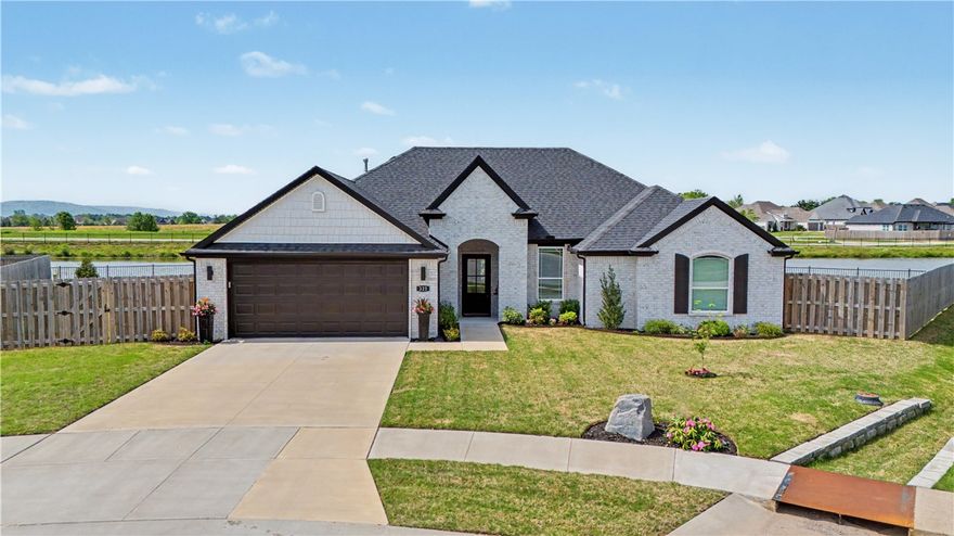 Waterfront living in... Farmington. Yes, really. Sounds too good to be true — until you're standing in this show-stopping, meticulously maintained home watching light move across still water with serene, beach-vibe views from every main room. Largest lot at the end of the cul-de-sac, wrapped on two sides by a sweeping community pond framed in low wrought iron. LIVING ROOM: gas fireplace, stone surround, crown molding, luxe-feel floors. DINING: corner nook wrapped in windows, water views, golden-hour light that has to be seen. KITCHEN: white cabinets, arabesque backsplash, gas cooktop, double wall oven, 3 cm quartz. PRIMARY: tray ceiling, soaking tub, double vanity, direct water views. SECONDARY BEDROOMS: vaulted ceilings, immaculate trim. OUTDOOR LIVING: covered patio, ceiling fan, dining space, open views to the Ozark ridgeline — breathtaking at every hour. Every finish upgraded above builder grade, with intention. One of those rare homes that photographs beautifully and must be seen to be truly understood.