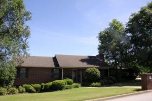 Lovely well maintained home in The Greens Subdivision on Cottonwood Road. 4 bedroom, 3 1/2 bath home - features open floor plan with spacious living room, kitchen and dining area., master bedroom & bath, 2 guest bedrooms, hall bath & 1/2 bath, large utility room which leads out to the 2 car attached garage. Roomy covered front porch and deck with privacy fenced back yard. Basement features - family room, bedroom, full bath and workshop area with a garage door. Harrison School District. Just a short distance to the Harrison County Club and Wal-Mart. New AC, New flooring in master bedroom, dining room and kitchen.