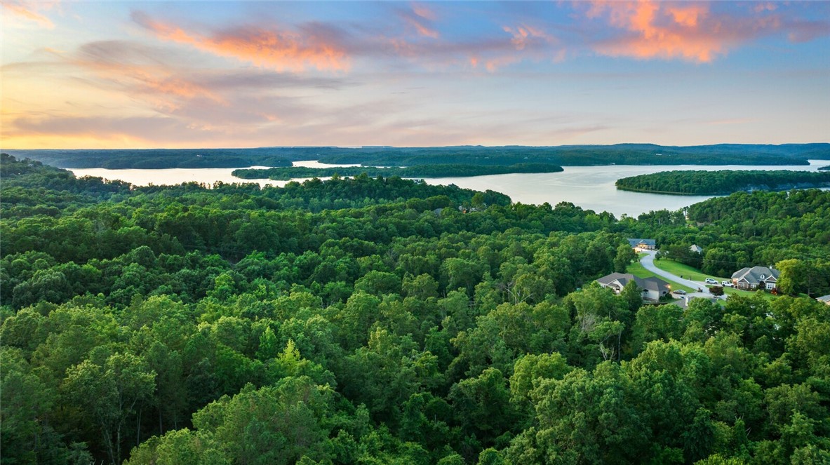 Wake Up to Beaver Lake Views—Every Day Feels Like a Vacation!
This cedar-clad 3-bed, 3.5-bath home on 0.86 acres offers resort-style living just minutes from Prairie Creek Marina. Enjoy panoramic lake views, a spacious sun deck, and a dreamy screened-in porch. Inside, you’ll find vaulted ceilings, granite countertops, dual fireplaces, and a finished walk-out basement perfect for entertaining. Plenty of storage for lake gear, all on a private wooded lot. Peaceful, scenic, and just a short 10 minute drive from town—lake life has never been easier. This is a rare find dont miss out on this amazing lake home!
Option to purchase a boat slip in community dock too!