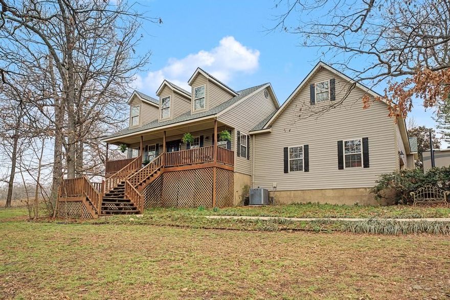 Want space and not isolation?  This one is for you!   Beautiful views, outdoor living spaces, inviting landscaping and more. Open floor plan is perfect for family time or entertaining.  Counter space for cooking up a storm & built in desk.  Vaulted bonus room. Cozy up to the wood burning fireplace or hang out on the spacious decks outside.  If floating in the pool is more your style, then we've got that covered as well.  Handy to all areas of NWA.  All new back deck and around the pool.  Roof replaced in 2026. Detached garage has two roll up doors.  Too many amenities to list so come see it in person.  Subject to filing of the final approved lot split recording for 2 acre lot split to the west. The City of Tontitown has stated they will be making Theresa Ln into a two lane road.