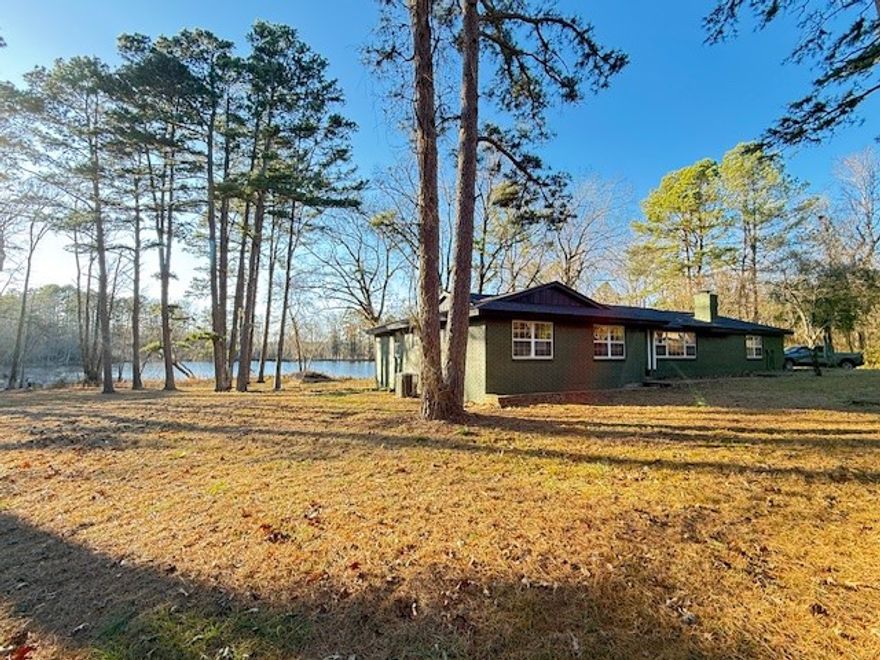 Beautifully remodeled, 2017 sft+/- (per appraisal) 3 bed 2 bath home just outside of Clarksville Arkansas in the foothills of the Ozark Mountains. NEW custom kitchen including granite counters custom cabinets LED lights and plumbing fixtures NEW: HVAC, roof, attic insullation, waterproof luxury vinyl flooring, wood burning fireplace, ceramic tile walkin shower and new tub with tile surround, new paint in and out, new stainless steel kitchen appliances, new plumbing and electirical fixtures. Includes 16.41+/- Acres w/ a 4 +/- acre pond and an out-building for your projects. Also has a 40'x50' concrete pad ready for your RV or a blank canvas for additional living space/shop building and a well for gardening.  Just a short drive to a public boat ramp on the lake, the Ozark National Forest and the Buffalo River. Nothing in this price range compares, call for your private showing today!!
