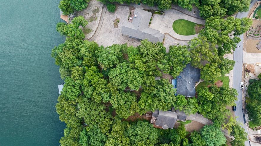 Nestled in the heart of Bella Vista, AR, this exquisite lakefront home on the serene shores of Lake Loch Lomond offers a perfect blend of luxury and tranquility. Imagine waking up to panoramic views of crystal-clear waters and lush greenery from your bedroom window, or enjoying your morning coffee on a spacious deck overlooking the lake. A meticulously landscaped yard with mature trees, vibrant flowers, and a private dock for boating, fishing, and swimming. The expansive deck and patio area are ideal for hosting gatherings or simply relaxing while taking in the breathtaking views. Are you looking for the perfect man cave? Look no further! This loft space located separate from the home offers a half bath and ample room to play. With an additional 432 sq. ft. of versatile space, it's not included in the home's total square footage. Take advantage of a $10,000 update allowance from the seller—turn this lake home into your dream oasis! Welcome HOME!