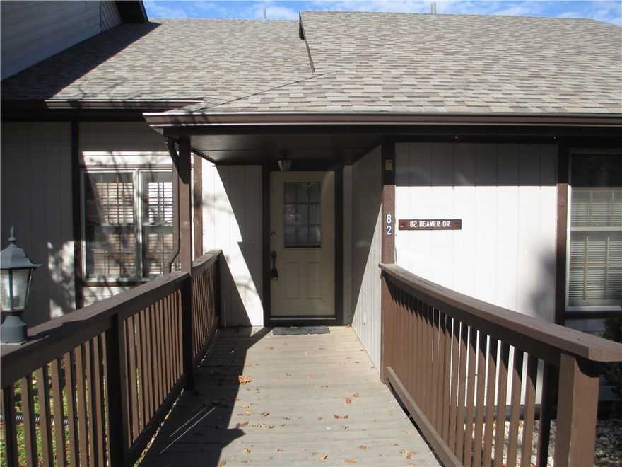 A place to stay and a place to play.  This condo offers either, a second home or rental opportunity. Main floor with it's large living area and eat in kitchen houses the primary bedroom with bath, plus a powder room for guests. A plethora of cabinet space, pantry & counter tops allows ample space for the chef. The deck on this level provides space for outdoor dining as well.  Upper level bedroom and bath have a Juliet balcony that offers far off views of the area.  Prime location, with nine hole golf course, rec center, tennis & pickle ball courts, two pools & marina only 5 minutes away. Come make this your getaway or primary residence where outside maintenance is done for you!  Furnishings convey.