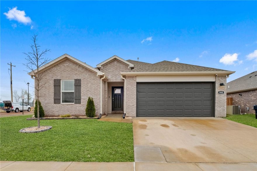 This all-brick 4-bedroom Rogers home is convenient to New Hope Rd. and I-49, but also to the newly revitalized Downtown Rogers area!  It has the added warmth of having been loved by a young family for the last two years, with some thoughtful updates, but also all the peace of mind that comes with buying a newer home. With 1600+ ft. and an open floor plan, there's plenty of room to entertain and gather, plus there's a covered patio and added firepit area to round out your entertaining options.  The kitchen features a gas range, microwave with vent-hood, and stainless-steel refrigerator to also convey with acceptable offer.  The primary suite is large with an ensuite that includes a tiled shower, dual vanity and walk-in closet.  Another short hallway leads to a hall bath and 2 bedrooms, and the front bedroom can easily double as an office or a playroom.  The backyard features a 6 ft. privacy fence with gate, and since this is a corner lot, there is a double gate to the side road!  Don't miss this one!