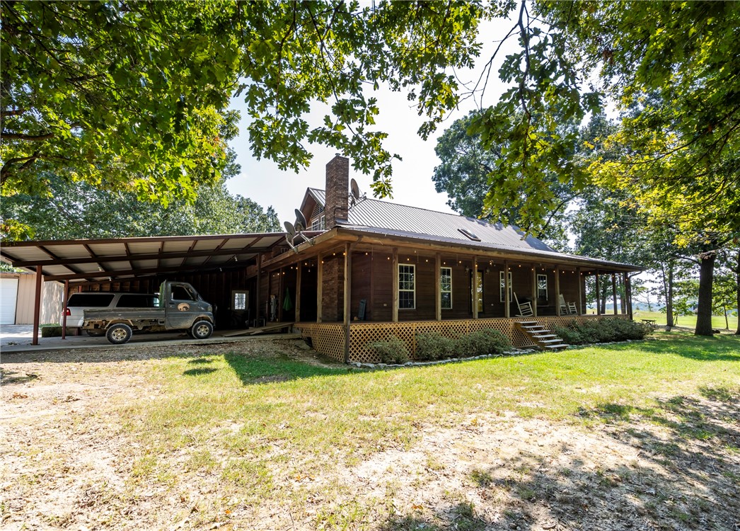 Welcome to this extraordinary 31-acre equestrian estate offering a rare blend of country living, modern amenities, and professional horse facilities. The spacious four-bedroom, three-bath home includes two bedrooms converted into a dormitory, perfect for guests, students, or staff. Enjoy a large in-ground pool and a 2 ½-car carport for convenience. Outbuildings include a separate garage with shop, a heated and cooled school/office building, a large hay barn, and a climate-controlled tack room. A 32x100 insulated dog kennel, partially heated and cooled, adds versatility. Designed for horse enthusiasts, the property features a large riding arena, ample hay storage, and a year-round spring and creek. With open pastures, scenic views, and efficient layout, this estate is ideal for a private equestrian retreat, training or boarding business, or multi-use agricultural venture. Combining comfort, functionality, and natural beauty, this property delivers a complete lifestyle package.