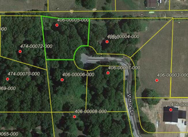 Nice lot on the end of a cul-de-sac. Has small prefab building that will be removed. Underground utilities and paved street frontage.