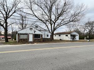 Commercial Property in a HIGH TRAFFIC Area! This property has 2 separate buildings on one lot near downtown Dover right on Highway 7. With some TLC, this place has a lot of potential!