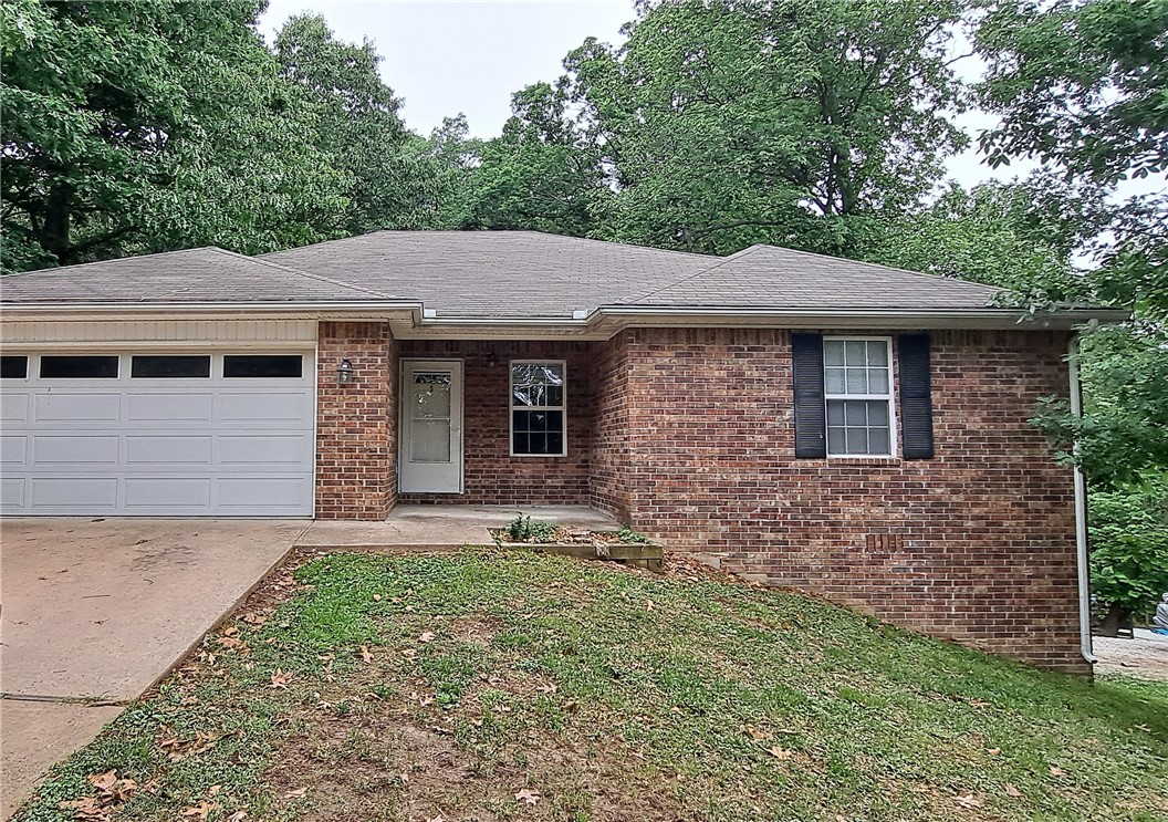 Nice home in the Wentworth Subdivision of Bella Vista. 3 BR / 2 BA, 2 car garage. Carpet in the bedrooms and hard surface flooring throughout living areas! Fireplace in the Living Area. Huge Master with His and Her closets. Beautiful setting overlooking a wooded area. ***Owner prefers no pets, but may consider a small dog.