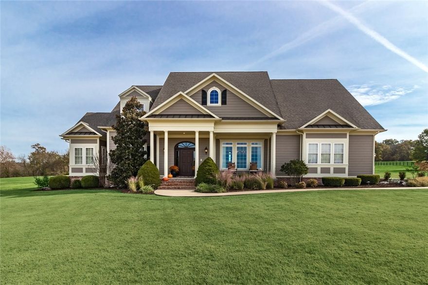 Gorgeous custom home situated on 13.84 manicured acres is perfect for entertaining family and friends, enjoying the peaceful landscape, riding horses, and more! Property borders Brush Creek, a year round wet creek. 4900 sq.ft. has 5 bedrooms, 4.5 baths and bonus room. Large master suite has spa-like bath. Beautiful pool and patio area with 393 sq.ft pool house. 32x54 2 story barn has 4 stalls, heated and cooled game room, kitchenette and full bathroom. A rare gem, centrally located in Northwest Arkansas.