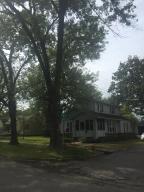 800 S Erie - This home has character. A Craftsman Bungalow it features a front screened porch!! Fantastic Large fenced corner lot. 3 bedroom 2 full bath, open kitchen. very neat classic home. Detached garage or workshop. storage shed. $114,900 MLS#17-2360