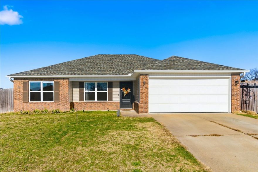 : Welcome to 15124 White Fawn Drive in Garfield, Arkansas. Built in 2017, this solid 3-bedroom, 2-bath home offers 1,422 square feet of well-planned living space with a 2-car attached garage. Recent updates include new flooring in the primary bedroom and closet, freshly painted kitchen cabinets, and a brand-new 20 x 15 concrete patio poured just off the back door—perfect for outdoor entertaining. The large backyard is fully privacy fenced, providing space to relax, play, or let pets roam. Conveniently located less than 15 miles from the Walmart Home Office, this home combines comfort with an easy commute. Qualifies for first-time homebuyer loan programs. Move-in ready and well maintained: Buyers move quickly on this one!