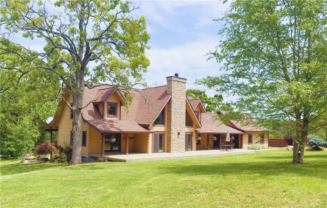 Discover the peaceful beauty of this one-of-a-kind custom log home, tucked away on 27 acres of unrestricted countryside. This property features a seasonal creek, a low-maintenance saltwater pool, and a three-car garage. Inside, the home offers inviting warmth with a wood-burning fireplace and pellet stove, along with a generous 900 sq ft loft—ideal for a kids' room, guest space, or creative retreat. The fully finished basement offers added flexibility for extended living or potential rental use.
Step outside to enjoy wide front and back decks for quiet mornings and lively gatherings. Whether you're dreaming of a private homestead, a weekend getaway, a vacation rental, or a future event space, this property offers unlimited potential. The seller is offering a $5,000 flooring allowance - personalize the space to your taste. Ten miles from Eureka Springs and eight miles from Table Rock Lake, this peaceful setting feels worlds away yet close to everything. It's a rare chance to create your own piece of paradise!