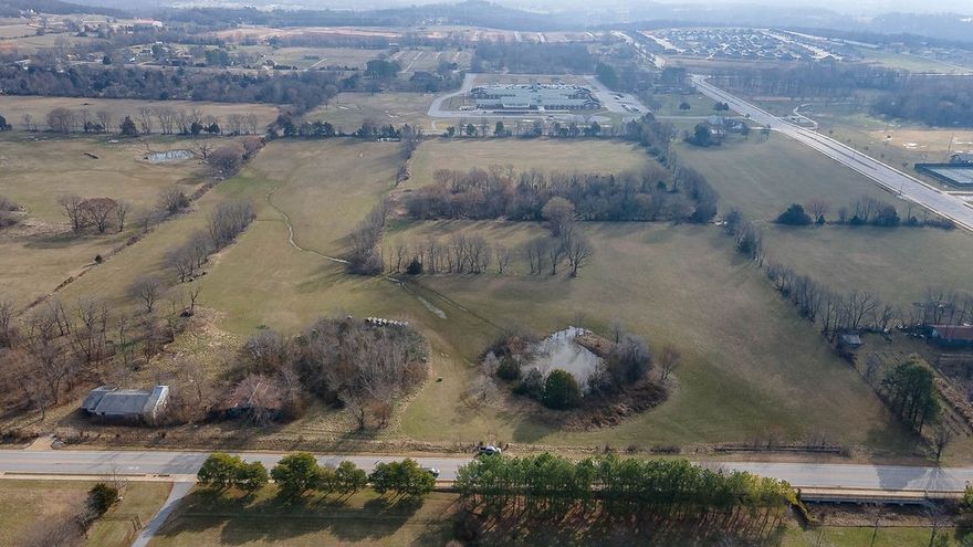 Excellent residential, multi-family, or mixed use development opportunity on 40 acres located at the corner of Hylton Road and Don Tyson in east Springdale. Most utilities on site or at road. Springdale public schools on two (2) sides of this property. The site can likely accommodate various housing types, including apartments, townhomes, and single-family homes. The development could also include community amenities such as a clubhouse, swimming pool, playground, and green spaces. Contact us for more info.