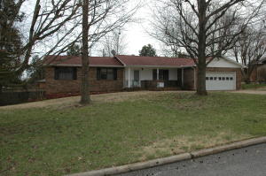 Nice 3 bedroom brick home with basement. Tree shaded back yard with privacy fence. Sunroom, deck, large living/family room. Basement workshop with overhead door, or could be used as garage for 3d vehicle or boat.