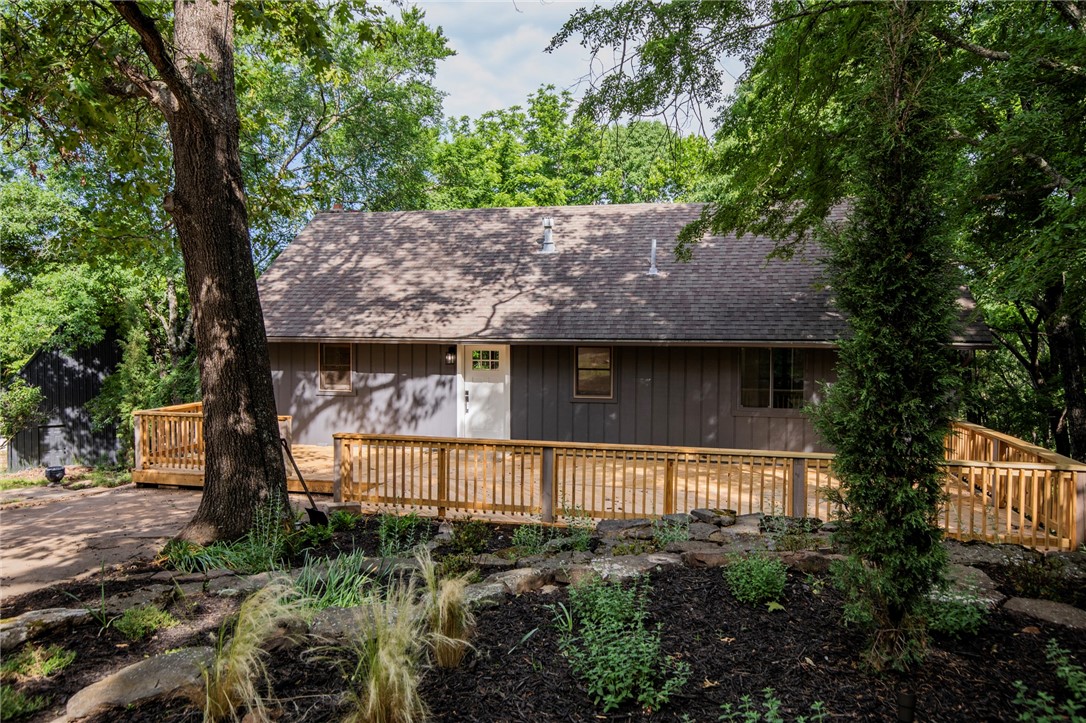 Come live the Lake Life in this tranquil, remodeled sanctuary. Immerse yourselfĀ in Nature....This gorgeous property offers seasonalĀ Beaver Lake views, on almost an acre, 3 bedrooms, 3 bathrooms, a bonus room, a 4 car garageĀ Workshop with space upstairs that can be completed as an additional living quarters, and 5 brand new decks between the home and workshop. Open concept living and kitchen. Primary bedroom has a stunning ensuiteĀ that includes a custom tile shower, large freestanding tub, touch free flush toilet, primary closet with its own laundry hook ups. Upstairs you will find another room with its own balcony. Downstairs you will find a bonus room, space for pool table/card table, another bedroom, and the main laundry room. TheĀ Workshop is Heated & Cooled and is a total of 2364sf with the main level being 1455sf and the upstairs being 909sf. Community amenities, including a Clubhouse, Pool, Fitness room, Playground, Rec room, Tennis courts, & Trails waiting to be explored.