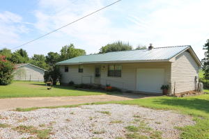 A quality construction, handicap accessible home on 3/4 acres in a small subdivision. Walking distance to banking, groceries, restaurant and school. New metal roof and large trees.