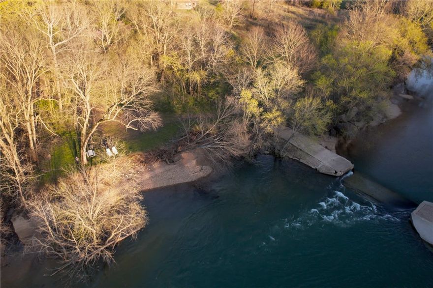 Fantastic opportunity to own a one of a kind property located directly on the banks of the gorgeous Kings River. This property is split between two parcels on either side of Highway 221. The land includes a future homesite with electric hookup, a riverside sandbar, and a deep water swimming hole. Located just 15 minutes from Eureka Springs and 10 minutes from Berryville, this hidden gem is busting with untapped potential.