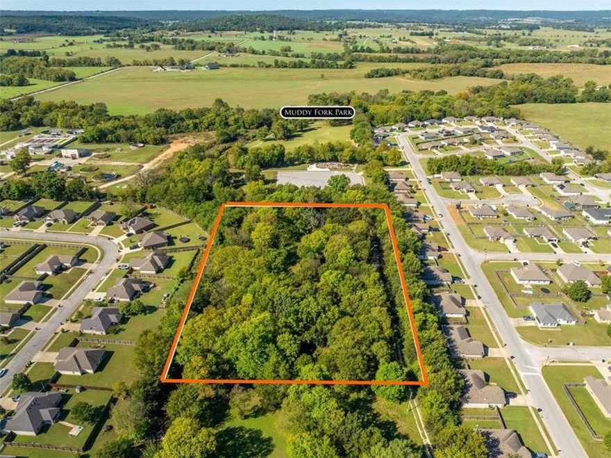 4 acres m.o.l. property located near nice subdivisions right in the city of Prairie Grove. Muddy Fork Park is right next door with playground, dog park, and walking trial. Great spot for an estate home or subdivide as you wish or possibly convert to multi family. 2 septic systems, electric, and public water all on site. There is an existing mobile home on the site that can be removed or possibility live in while building. The mobile conveys "AS IS". The possibilities are endless with this property. Call us today for a showing or particulars.