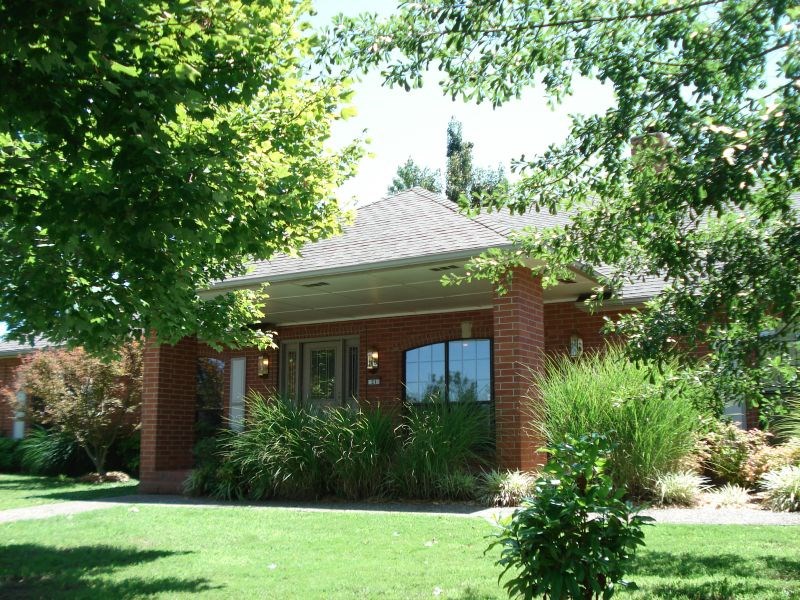 3 bed two full baths, Brick home with covered front porch, screened back porch, fireplace with custom built-ins, vaulted ceilings. Breakfast bar, center island, and under cabinet lighting. Separate dining and bonus area. Master bedroom has built-in for TV and storage.