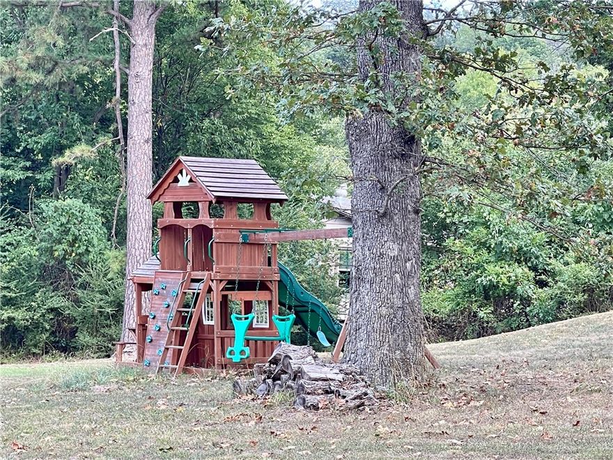 This 4 acre property presents a rare opportunity to own more than a small lot within the city limits, boasting a picturesque park-like setting and effortless access to local amenities. The 2-bedroom, 2-bathroom residence offers 1680 sq ft of living space, office/flex room off the kitchen, further enhanced by a spacious 288 sq ft screened porch/sunroom in the front entrance of the home. A separate 10x16 building provides versatility for use as an art studio, office, or guest room.Ample storage space is available in the garage. This home showcases character and charm, set amidst a serene 4-acre backdrop within the city limits.With convenient access to Hwy 412, discover NW AR's comprehensive trail network featuring biking, hiking, and mountain biking trails.Enjoy a variety of outdoor pursuits, including camping, fishing, and water sports, with easy access to Beaver Lake, War Eagle Creek, and the Buffalo National River. Utility availability is the responsibility of the buyer or buyers agent.