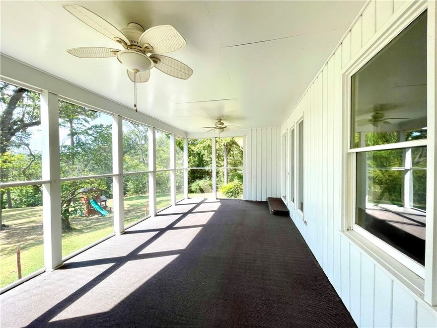 This 4 acre property presents a rare opportunity to own more than a small lot within the city limits, boasting a picturesque park-like setting and effortless access to local amenities. The 2-bedroom, 2-bathroom residence offers 1680 sq ft of living space, office/flex room off the kitchen, further enhanced by a spacious 288 sq ft screened porch/sunroom in the front entrance of the home. A separate 10x16 building provides versatility for use as an art studio, office, or guest room.Ample storage space is available in the garage. This home showcases character and charm, set amidst a serene 4-acre backdrop within the city limits.With convenient access to Hwy 412, discover NW AR's comprehensive trail network featuring biking, hiking, and mountain biking trails.Enjoy a variety of outdoor pursuits, including camping, fishing, and water sports, with easy access to Beaver Lake, War Eagle Creek, and the Buffalo National River. Utility availability is the responsibility of the buyer or buyers agent.