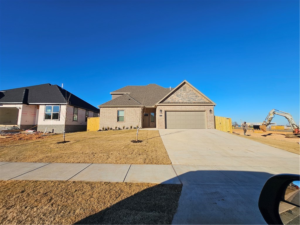 So much storage in this new construction home! Located just 10 minutes from XNA. This home has a soaring two story ceiling in the living room to showcase the lovely fireplace. The kitchen features a gas cooktop with wall oven, large island and pantry. In the primary suite, soak your day away in the free-standing soaker tub, or immerse yourself in a steamy shower in the large walk-in shower. Do you have an expansive wardrobe? The closet has a built-in dresser and plenty of room for all your clothes! There are two roomy storage closets on the main level as well as one guest bedroom and full bath guest bath. Upstairs you will find two more guest rooms and another full bath. Both upstairs bedrooms have very generous sized closets. The backyard is fenced for your privacy.