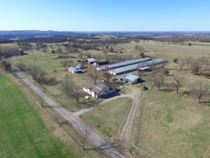 22 Acres located only 5 miles from Berryville on paved road, close to Kings River and Table Rock Lake, Horse farm, cattle farm, current Tyson Contract on 2 Broiler houses, 5BR, 4BA home with additional large family room or could be main level master BR and bath. Vaulted ceilings in Living Room, electric central HVAC, Country Flame Fireplace insert ducted to heat house, Attic fans, large attic storage room, patio, covered porch, 2 wells, rural water tap paid, shops, barns, working pens, 3 ponds, all fenced and cross fenced, 4 stall horse barn and arena.