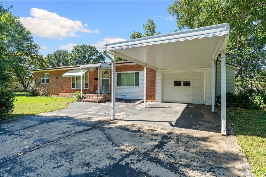 Check out this charming home in the heart of Pea Ridge! This well-maintained 2-bedroom, 1.5-bath property offers a quiet and convenient location close to downtown, Walmart, top-rated schools, and the soon-to-be new city park. Lovingly cared for over the years, this home is move-in ready and just waiting for your updates to make it your own.
The converted garage adds valuable living space—perfect for a second living room, home office, or hobby area—while still allowing space to park in the remaining single-car garage. The spacious kitchen features quality cabinetry and opens to a comfortable main living area, ideal for everyday living. Step outside to enjoy the fully fenced backyard, complete with an outbuilding shop with a concrete floor and garage roll up door—perfect for projects or storage.
This home is adorable, versatile, and full of potential. Ask for the video walk-through link or schedule your private showing today!