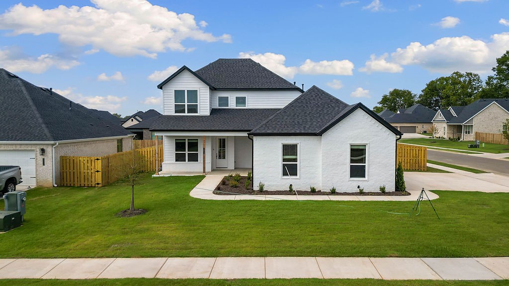 Pea Ridge is an up-and-coming community in Northwest Arkansas, Yorktown offers the perfect opportunity to find your dream home. This affordable, scenic, and well-maintained area caters to a variety of lifestyles, making it an ideal place to live. Upon entering the Willow Plan, you're welcomed by a charming front porch. Inside, an office space with wood accent walls greets you, LVP leads you into the open-concept living, kitchen, and dining area. The kitchen is equipped with 3CM granite countertops, custom cabinets, and a beautifully crafted wood hood. Conveniently located off the garage are cubbies, the utility room, and a powder room. The primary bedroom features exposed beams and an ensuite bathroom. Upstairs, you'll find three additional bedrooms, each with spacious walk-in closets.The covered back patio, perfect for relaxing or entertaining.For a limited time rates starting at 4.99% OR $7,500 from builder & up to $4K from preferred lender.